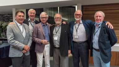 Group of male executives smiling