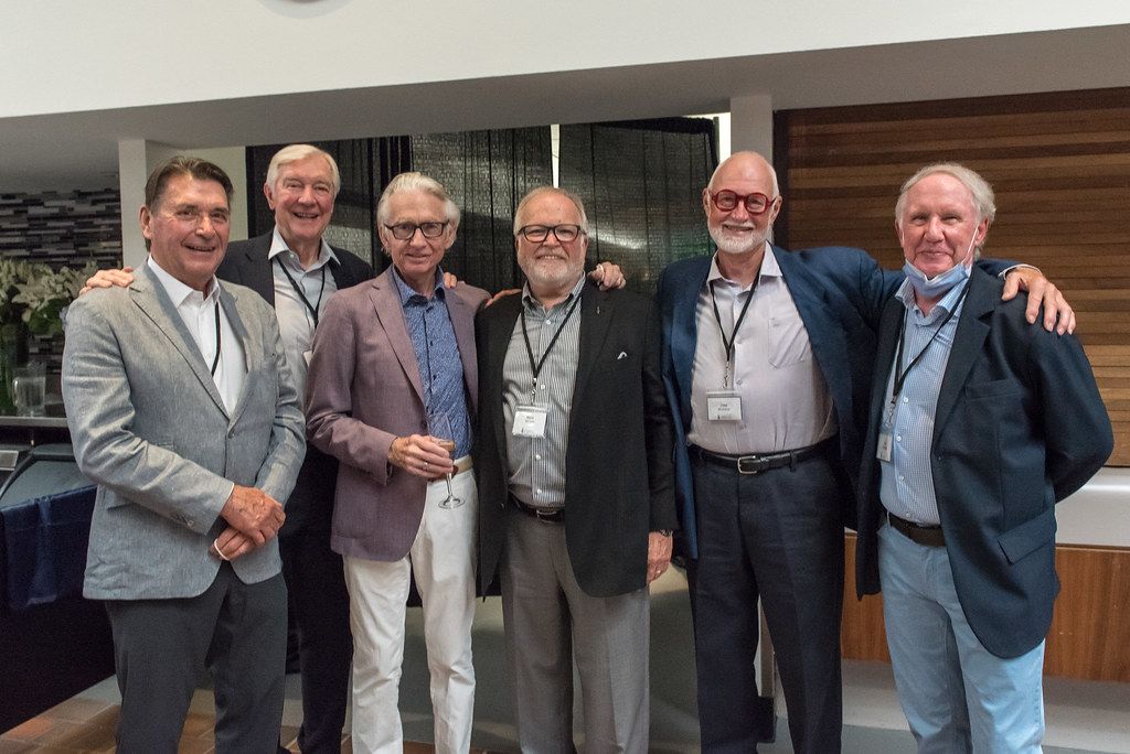 Group of male executives smiling